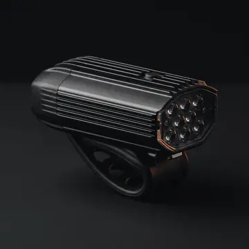 A front bike light on its handlebar strap